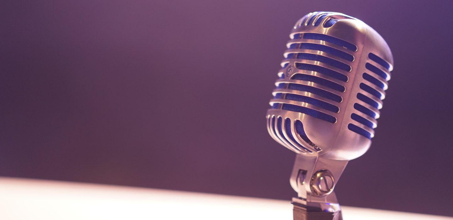 Purple tinted old-school microphone